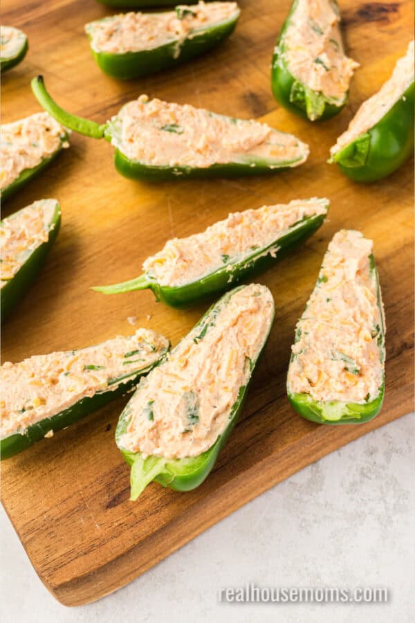 halved jalapeno peppers filled with cream cheese mixture