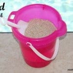 sand pudding in a pail with a sand shovel