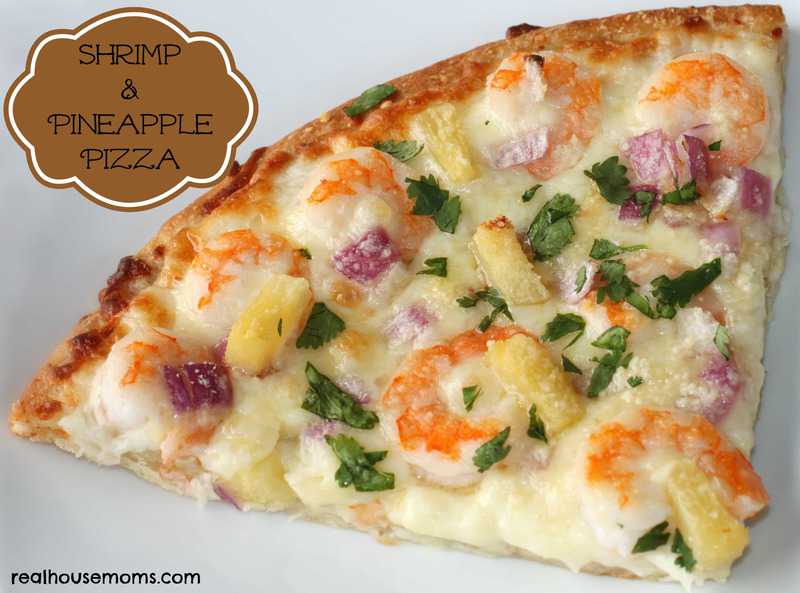 shrimp and pineapple pizza topped with red onion and cilantro