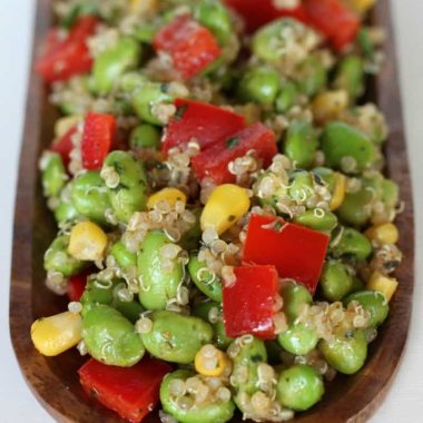 Edamame Quinoa salad in a wooden boat bowl