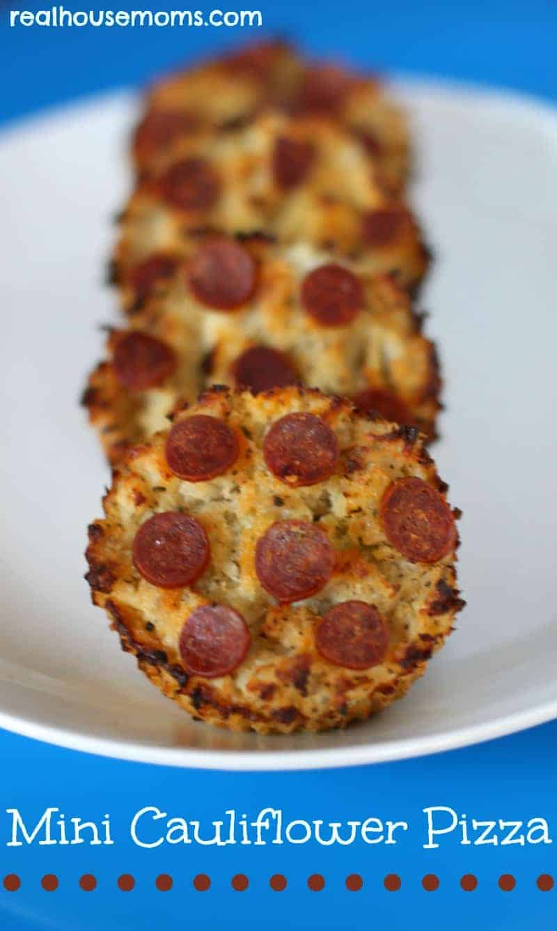 mini cauliflower pizza bites on white plate
