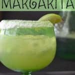 pineapple coconut margarita in a glass with salted rim and lime garnish