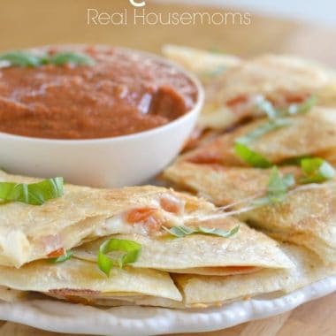 Margarita quesadillas on a plate with dip