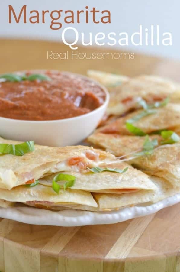 Margarita quesadillas on a plate with dip