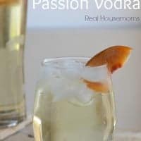 peachy passion vodka in a glass with peach slice garnish