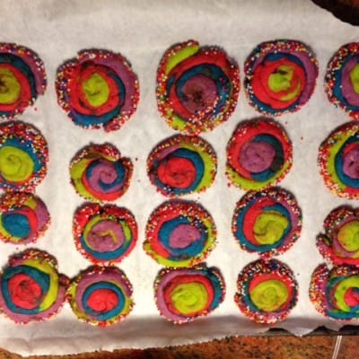 rainbow sprinkle shortbread melt away cookies on a baking sheet