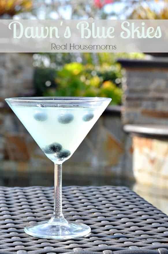 dawns blue skies cocktail in a martini glass