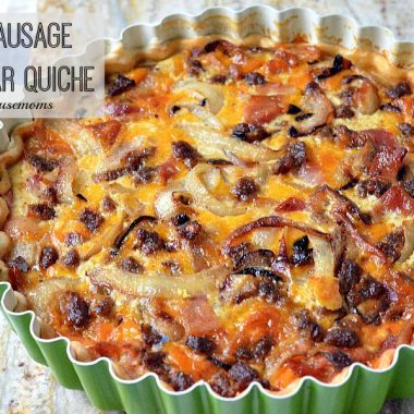bacon sausage and cheddar quiche in a tart pan