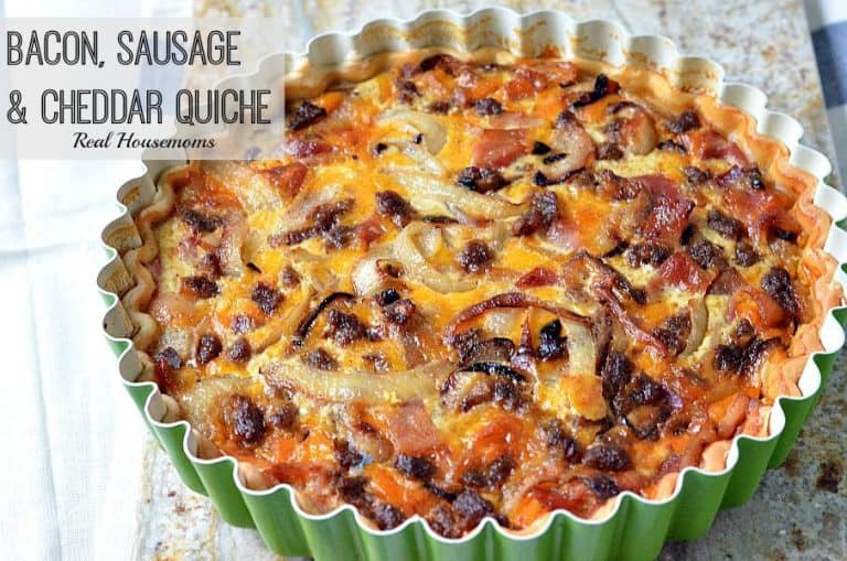 bacon sausage and cheddar quiche in a tart pan