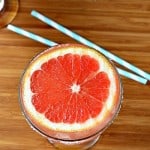 grapefruit margarita topped with a slice of grapefruit