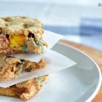 cookie bars stacked on a white plate