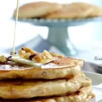 carrot cake pancakes stack topped with syrup