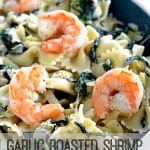 garlic roasted shrimp atop spinach artichoke pasta