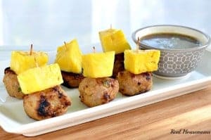 pineapple teriyaki turkey meatballs topped with pineapple on a serving platter