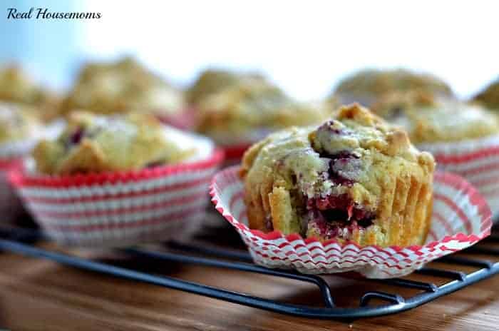 raspberry muffins on a baking rack