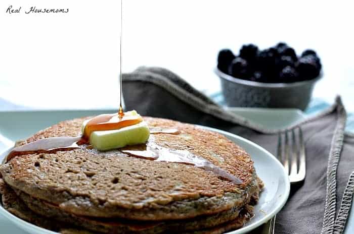 Fluffiest Whole Wheat Oatmeal Blackberry Pancakes topped with butter and syrup