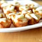 Pear Caramelized Onion and Brie Bites arranged on a platter