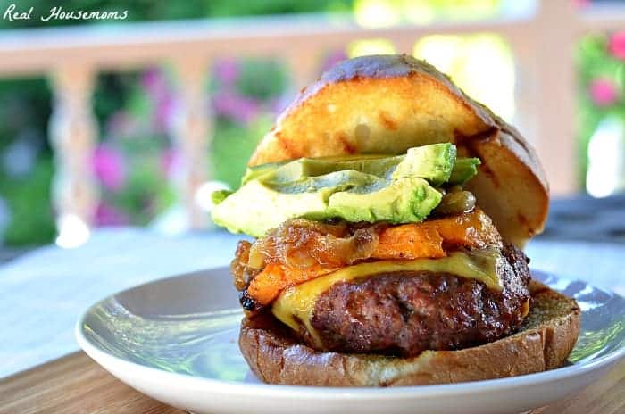 The ultimate Burger with avocado on white plate