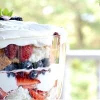 close up of Berries and Cream Angel Food Trifle displayed in a parfait glass
