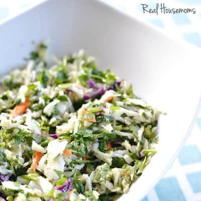 Citrus cilantro slaw in a white bowl