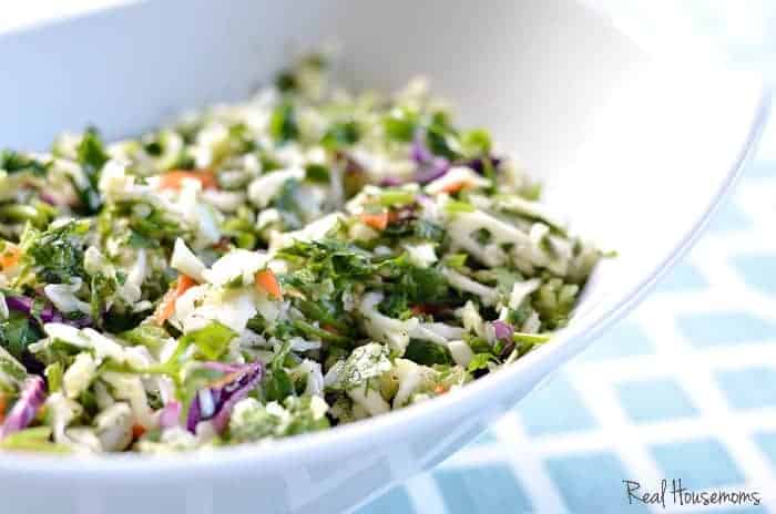 Citrus cilantro slaw in a white bowl