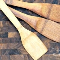 How to clean and condition wood cutting boards and utensils so they will last for years photo shows wooden utensils on cutting board