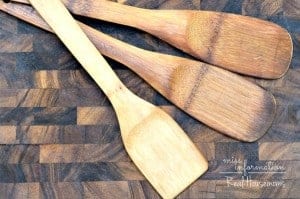 How to clean and condition wood cutting boards and utensils so they will last for years photo shows wooden utensils on cutting board