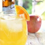 Wicked Good Cider Cocktail garnished with orange slice | Real Housemoms