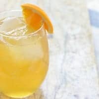 Wicked Good Cider Cocktail garnished with orange slice