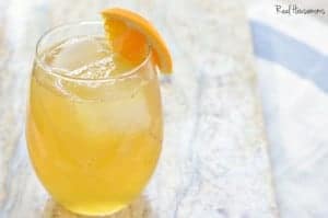 Wicked Good Cider Cocktail garnished with orange slice
