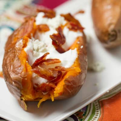 loaded Sweetpotatoes served on a white sharing dish