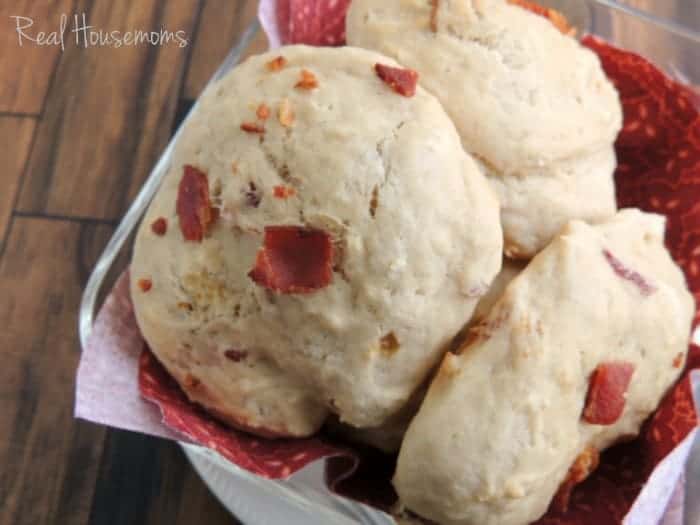 close up of Bacon Beer Bread Drop Biscuits served in a clear bowl