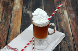 whipped hot toddy served in a glass topped with whip cream