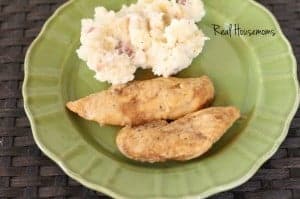 crockpot maple dijon chicken tenders with a side of mashed potatoes served on a green dish