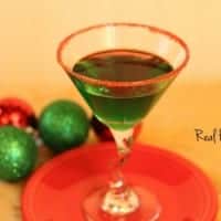 mistletoe mint martini, A green cocktail served in a martini glass, displayed on a red serving tray with red sugar on the rim