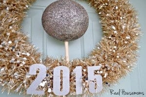 New Year's Wreath. Festive gold and silver wreath with a silver ball in the middle. wreath says "2015"