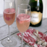 Champagne Floats, Pink Champagne in two Champagne glasses