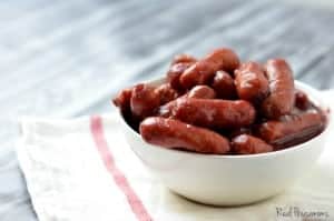 Crock Pot Cranberry and Sriracha Lil Smokies. served in a white sharing bowl