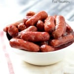 Crock Pot Cranberry and Sriracha Lil Smokies. served in a white sharing bowl