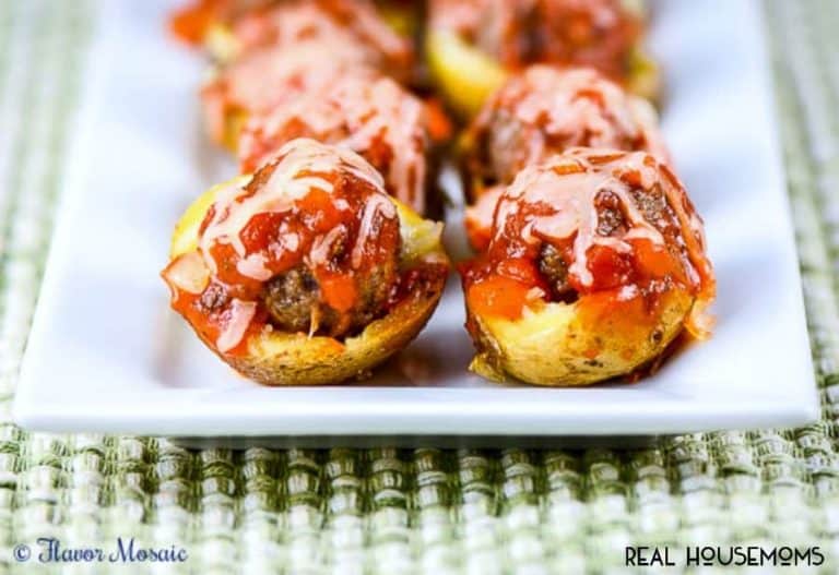 Meatball Marinara Potato Skin Bites. Marinara on top of potato skins, served on a white serving dish