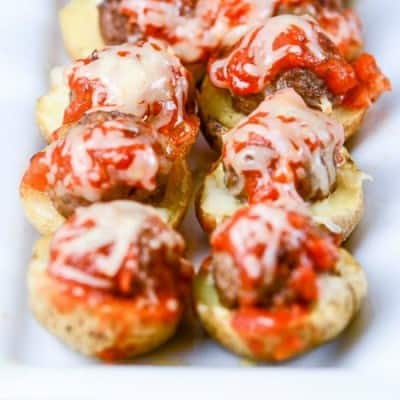 Meatball Marinara Potato Skin Bites. Marinara on top of potato skins, served on a white serving dish