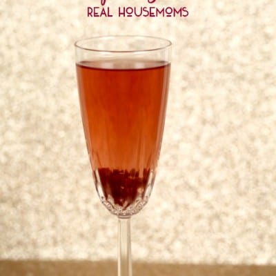 Pomegranate Spritzer served in a champagne flute