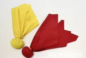 easy diy penalty flags. Yellow and red flag filled with Quinoa secured with rubberband