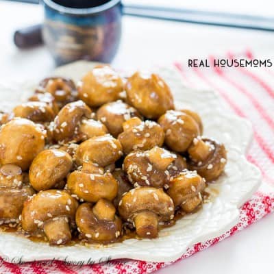 Hero Sesame Garlic Mushrooms, Mushrooms covered in Seasame Garlic sauce, served on a white sharing plate