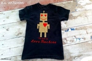 Design your own tshirt, DIY, t-shirt design with iron on vinyl. Black Kids shirt with design of a gold robot with red heart eyes and smile. Shirt reads "I'm just a Love Machine"