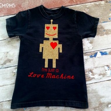 Design your own tshirt, DIY, t-shirt design with iron on vinyl. Black Kids shirt with design of a gold robot with red heart eyes and smile. Shirt reads "I'm just a Love Machine"