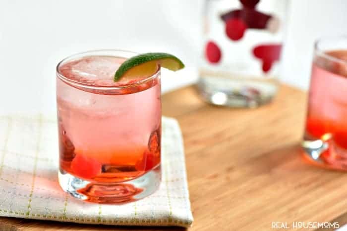 Dirty Shirley cocktail. Adult Shirley Temple. added liquor served in a short glass garnished with a lime
