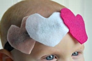 Easy Valentine Headbands for babies. Head band on babys head with three felt hearts two pink one white