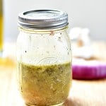 Quick and Easy Italian Dressing. Displayed in a mason jar. Dressing filling the jar half full.