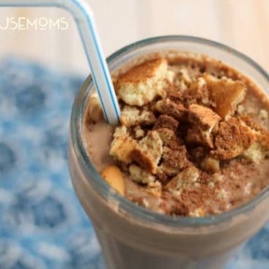 close up of Skinny Tiramisu Smoothie. served in a smoothie glass with a white and blue straw